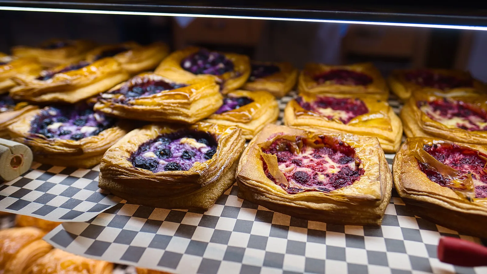 Pastries on display in a bakery case. The photo was not taken in Fort Myers.