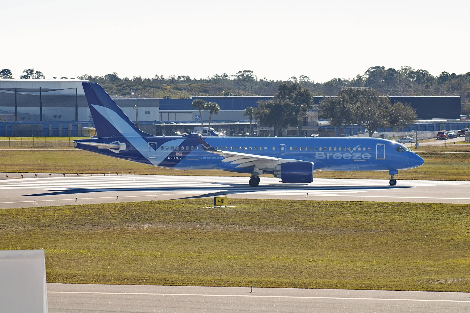 A Breeze Airways Airbus A220-300 on the taxiway at Daytona Beach International Airport, Florida.