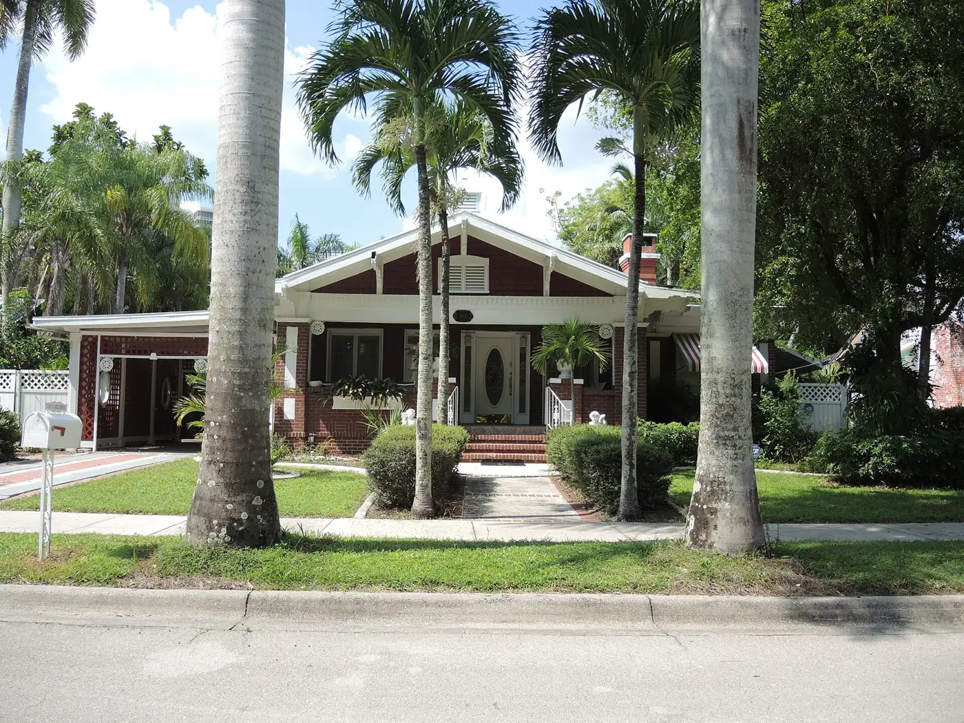 A bungalow on a palm-lined street in the Dean Park Historic Residential District of Fort Myers, in ZIP code 33901.
