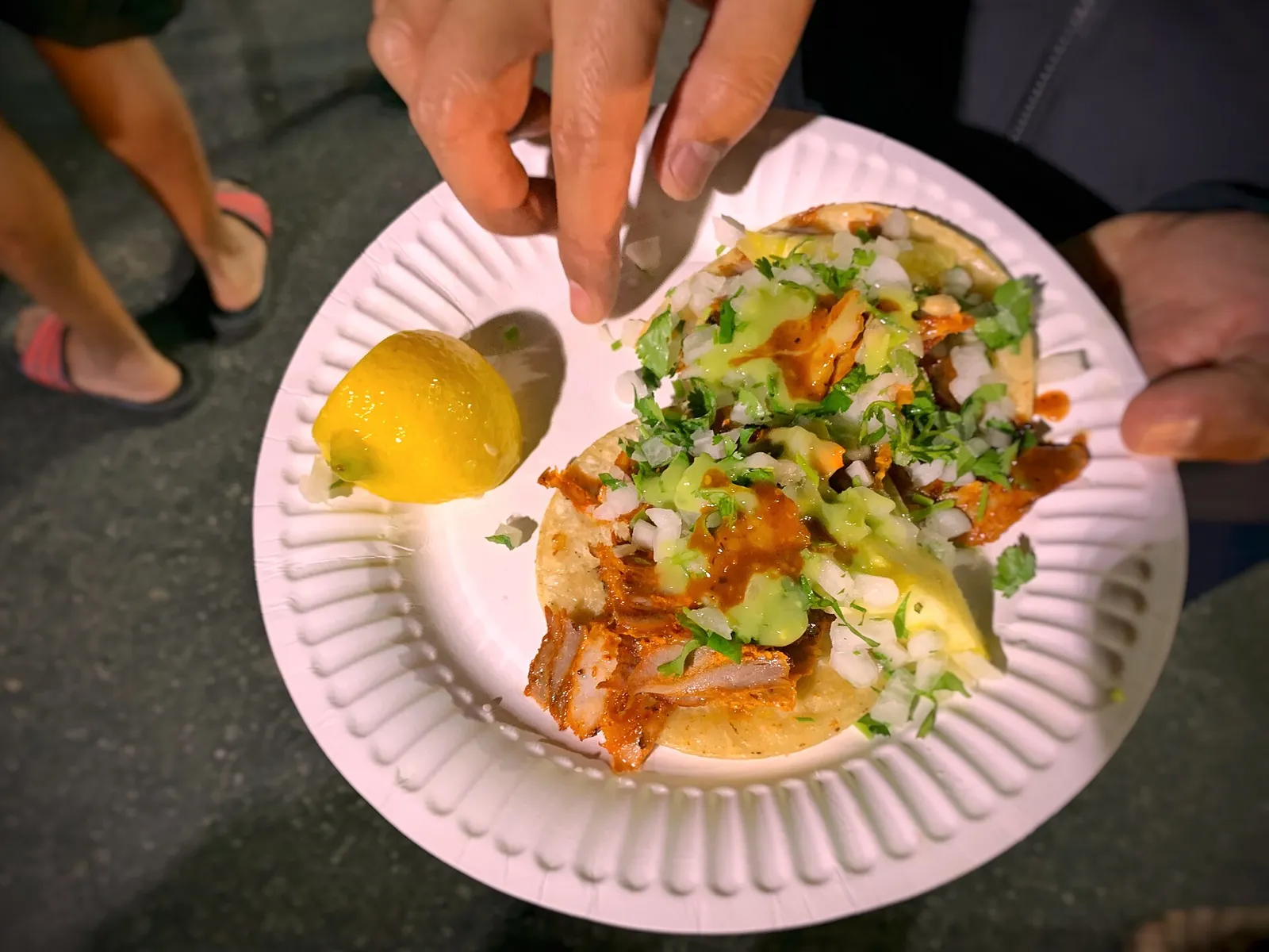 Tacos al pastor on a paper plate. The photo was taken in Los Angeles, not at a Fort Myers restaurant.