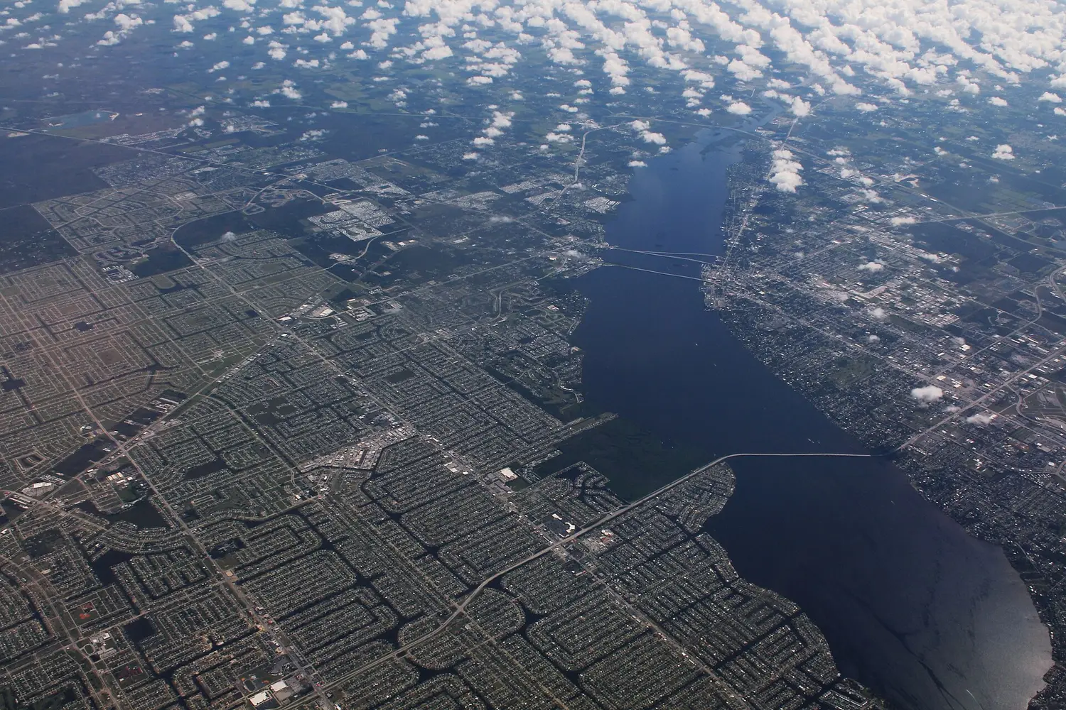 Fort Myers, right, and Cape Coral, left, on either side of the Caloosahatchee River, seen from the air.