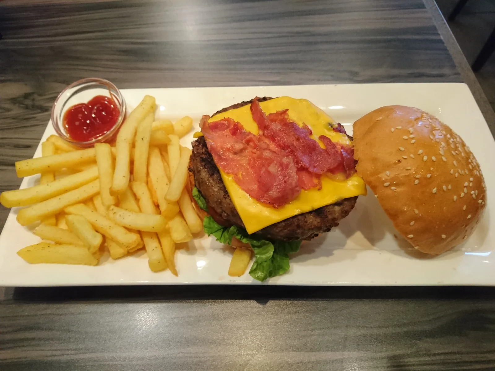 A bacon cheeseburger with fries. The photo was not taken at a Fort Myers restaurant.